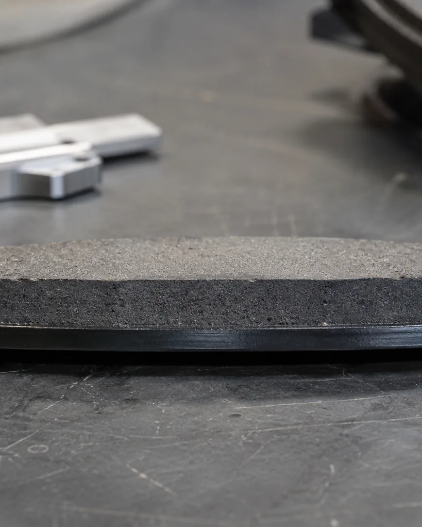 Detail view of new brake pad thickness: where the numbers start
